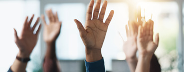 Employees voting by raising hands